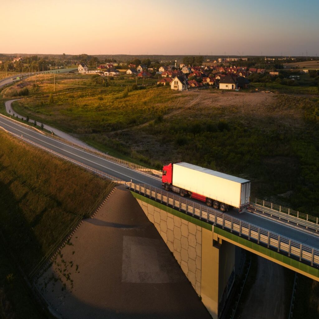 Autonomous truck on bridge represents a shift in the trucking industry to more driverless vehicle operations.