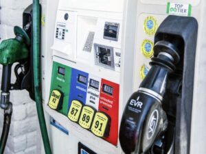 fuel pump at a gas station showing high prices for gasoline and diesel fuel