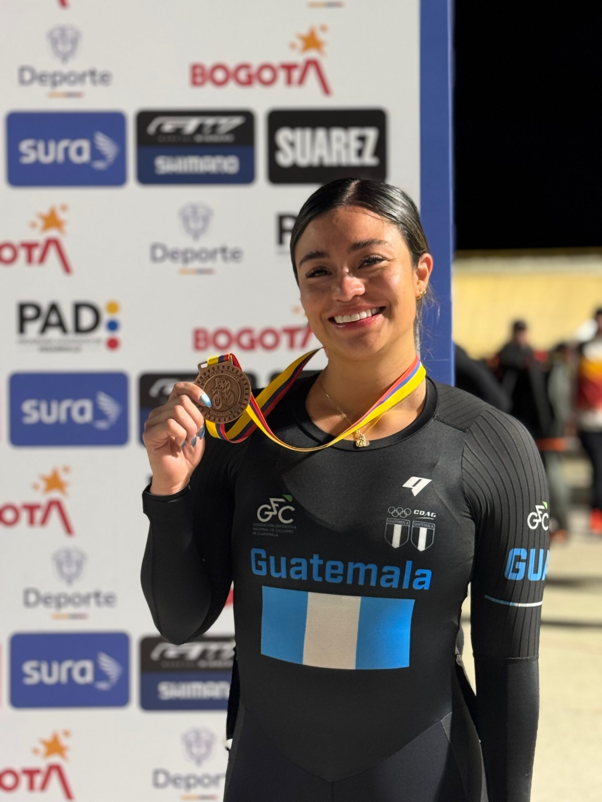 Nicole Hacohen shows off her cycling medal